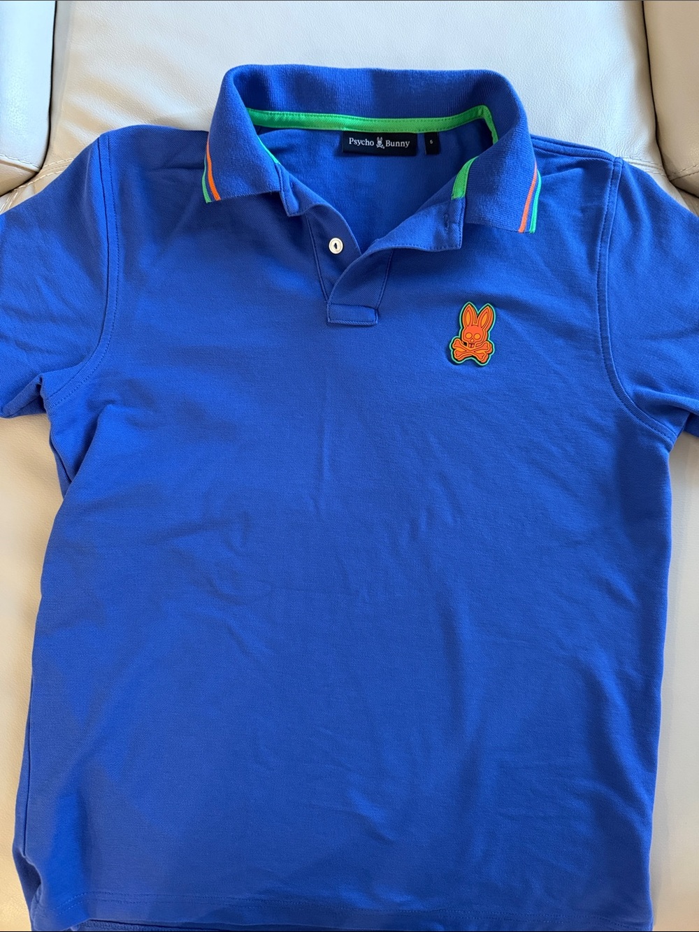 Psycho Bunny Royal Blue Polo with Orange Bunny Patch and Green Trim